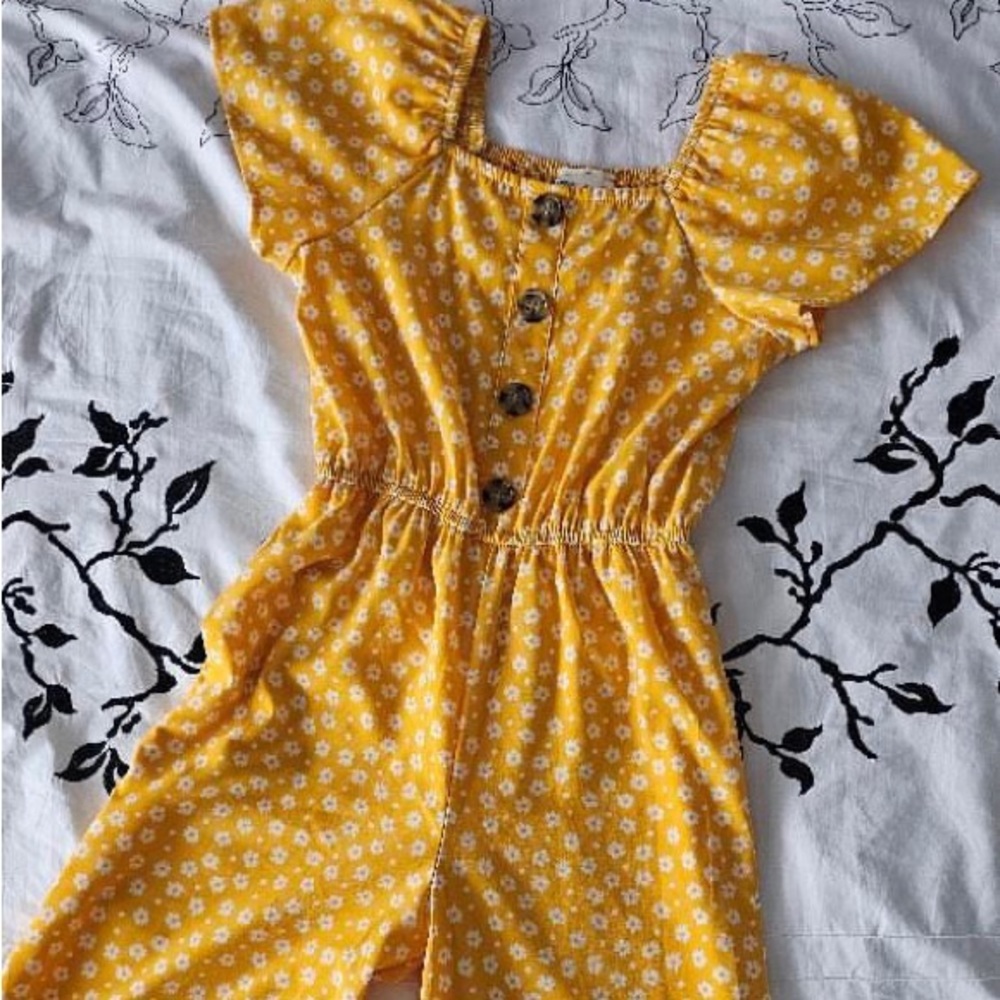 Yellow jumpsuit with white flowers